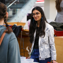 Aleezah speaking with a student
