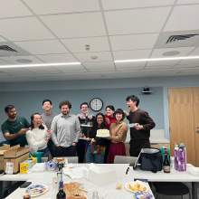 Allard Lab group photo featuring the trophy and cake we won from the Cell Bio Retreat pumpkin carving contest